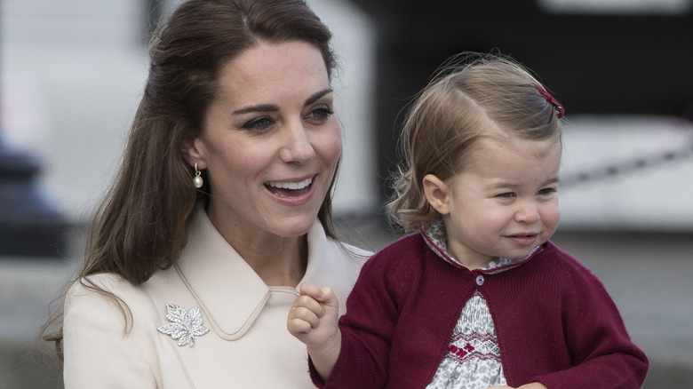 Kate Middleton smiling with Princess Charlotte 