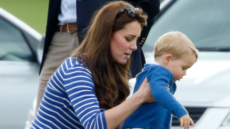 Princess Catherine, holding Prince George