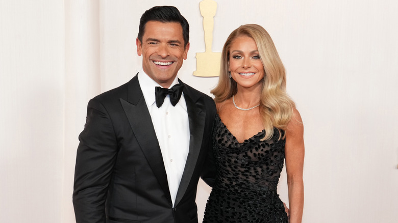 Mark Consuelos and Kelly Ripa smiling at the Emmy Awards