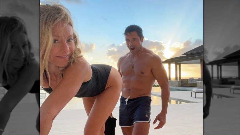 Kelly Ripa sticking her butt out for Mark Consuelos