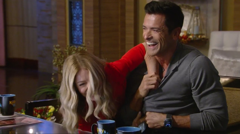 Kelly Ripa laughing with Mark Consuelos on Live