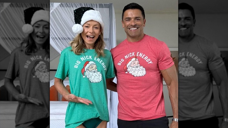 Kelly Ripa in underwear posing with Mark Consuelos in Christmas shirts