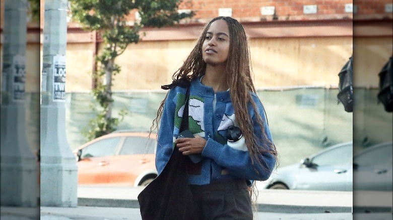 Malia Obama wearing blue sweater