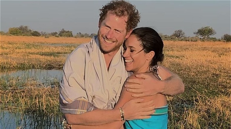 Harry and Meghan hugging on their first trip to Botswana