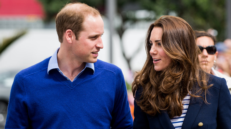 Prince William and Kate Middleton speaking and walking