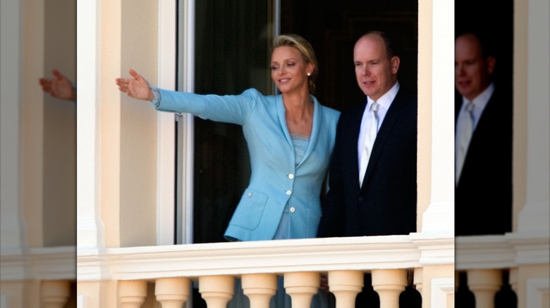 Charlene waving from palace window