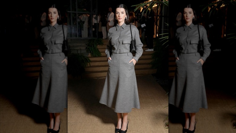 Kyra Kennedy in a gray Brunello Cucinelli jacket and skirt