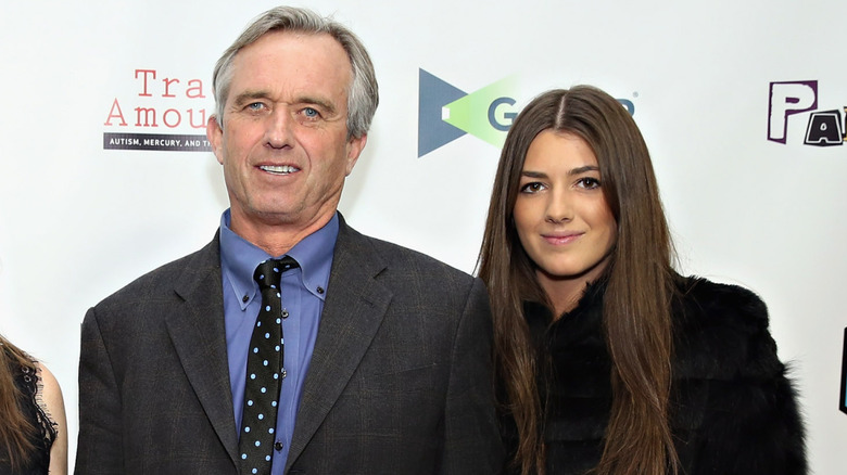 Robert F. Kennedy Jr in a polka-dot tie with Kyra Kennedy in a black fur coat