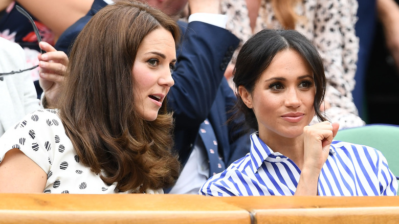 Princess Catherine speaking to Meghan Markle