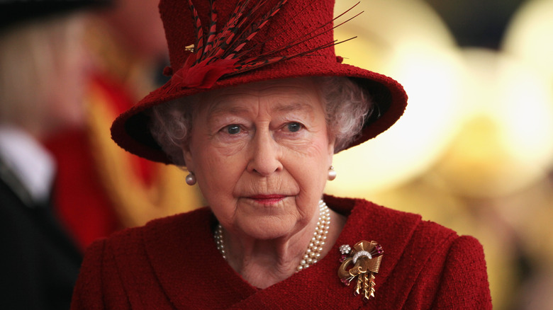 Queen Elizabeth looking grave