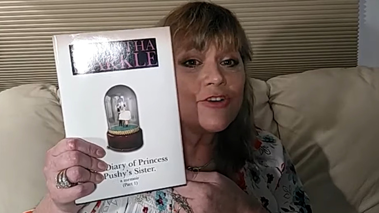 Samantha Markle holding her book