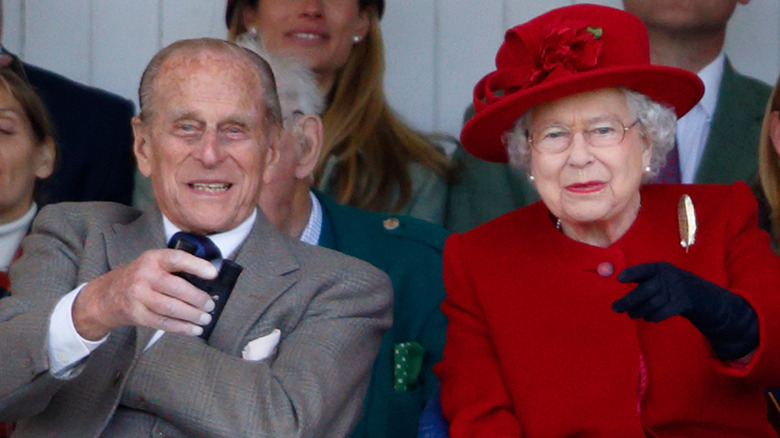 Philip laughs with Queen Elizabeth