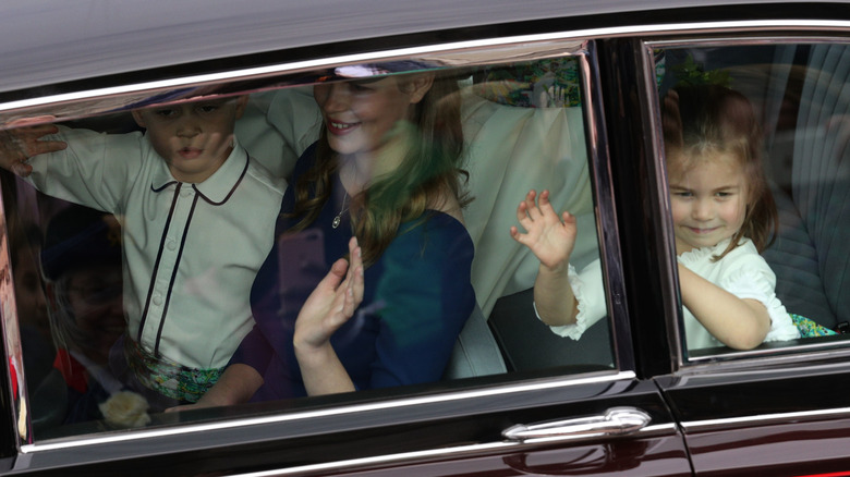 royals Prince George and Princess Charlotte in car