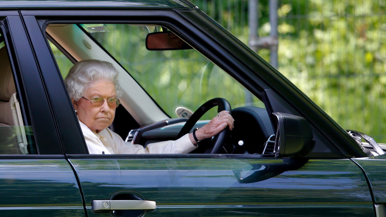 Queen Elizabeth II driving a car 