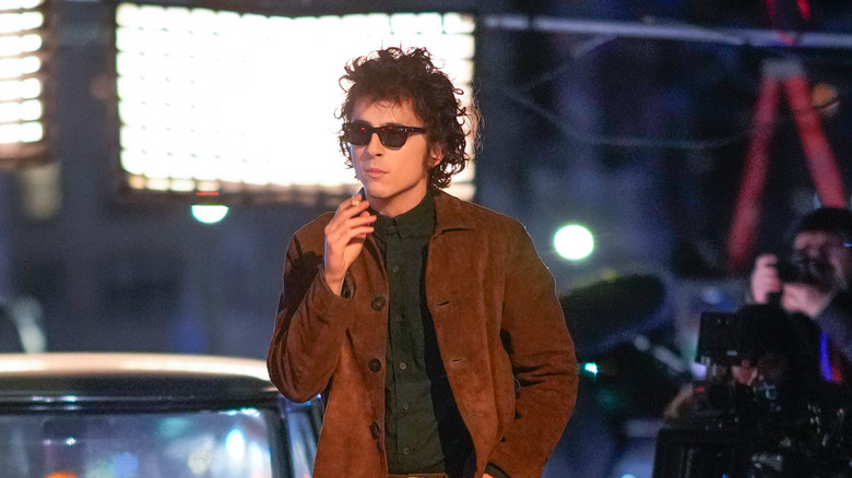 Timothée Chalamet smoking as Bob Dylan