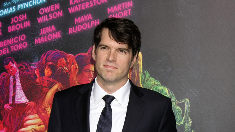 Timothy Simons wearing a dark suit