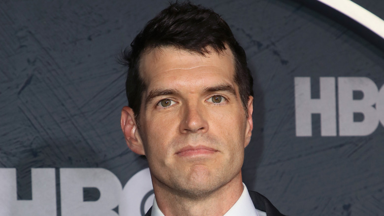 Timothy Simons against a gray background