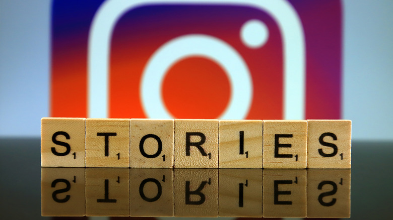 Word stories made of small wooden letters, and Instragram logo in background