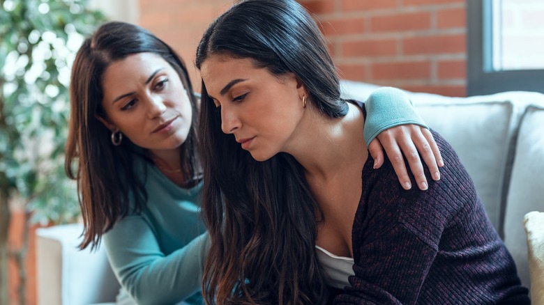 woman consoling friend