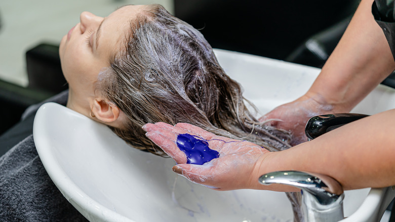 woman at salon purple shampoo