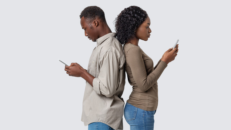 Couple using cell phones