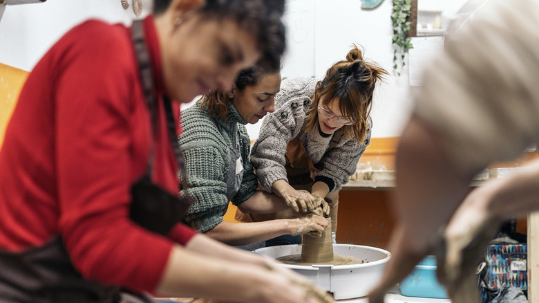 women at pottery class