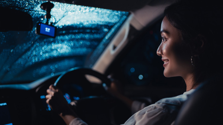 woman driving car at night