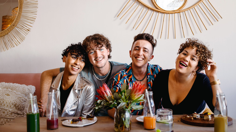 Four friends at a table