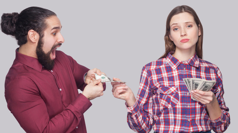 friend handing friend money