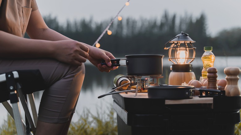 woman cooking on camping trip