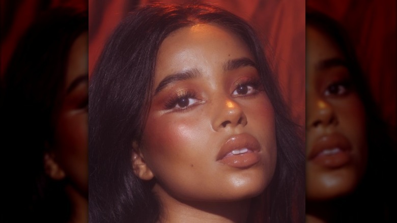 A woman with glowy bronze makeup