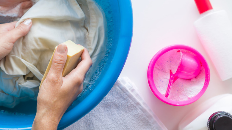 Person removing stains from washing