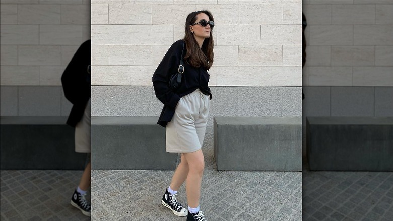 Black button-down and sweatshorts styling