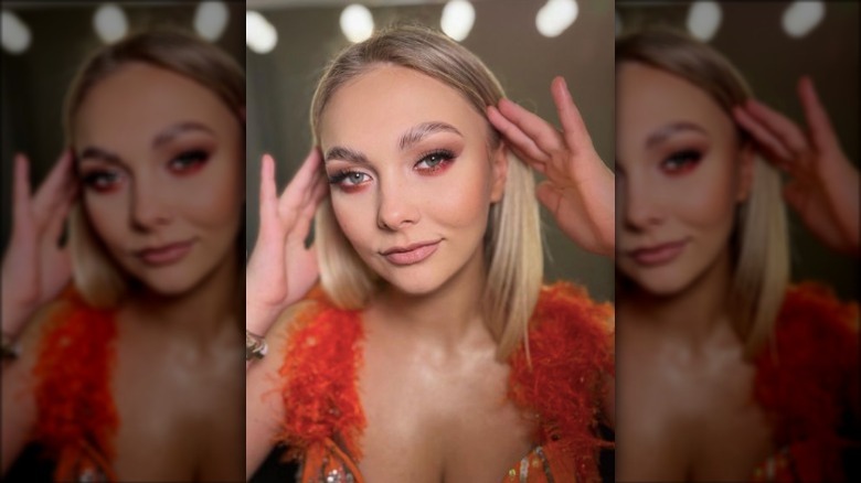 blonde woman posing in matte makeup