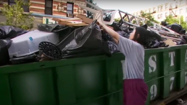 Woman dumpster-diving on "Extreme Cheapskates"