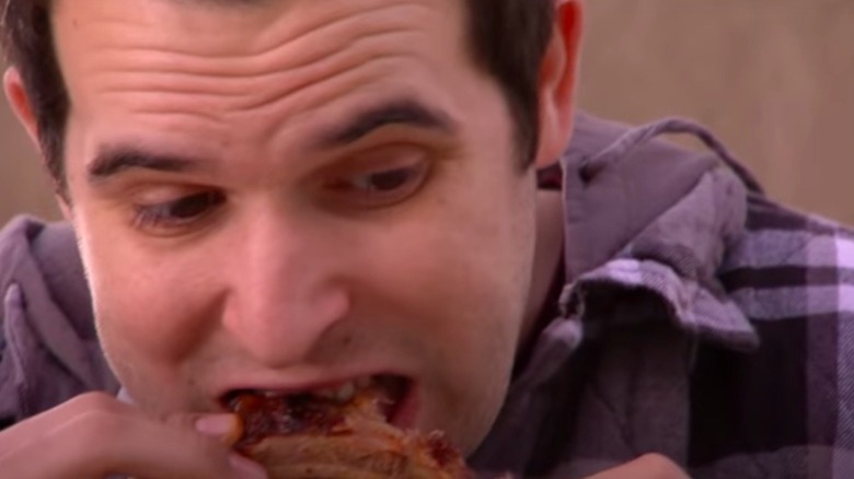 Man eating pizza on "Freaky Eaters"