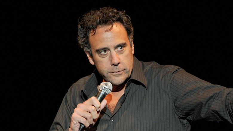 Brad Garrett holding mic