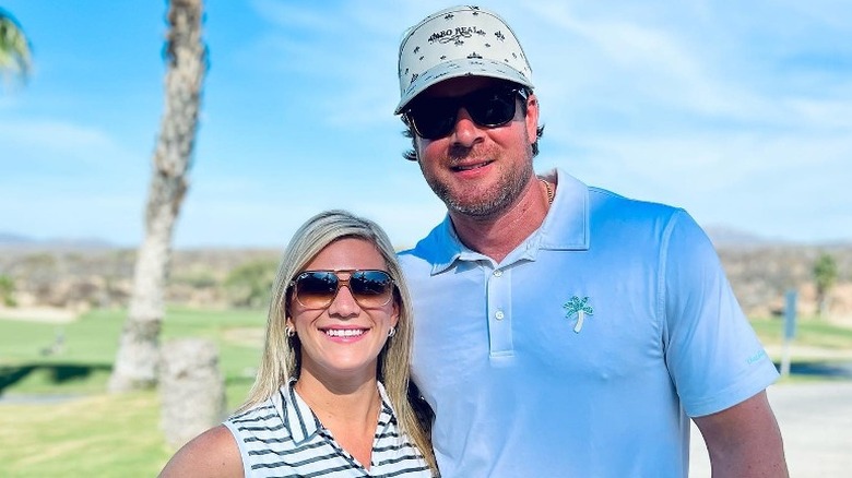 Dale and Kiki Mills outdoors in golf apparel