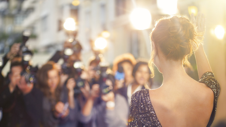 A woman turned toward cameras