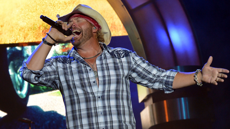 Toby Keith singing passionately in 2012