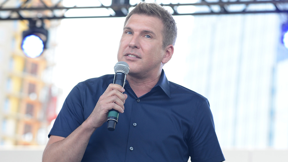 Todd Chrisley speaking into microphone