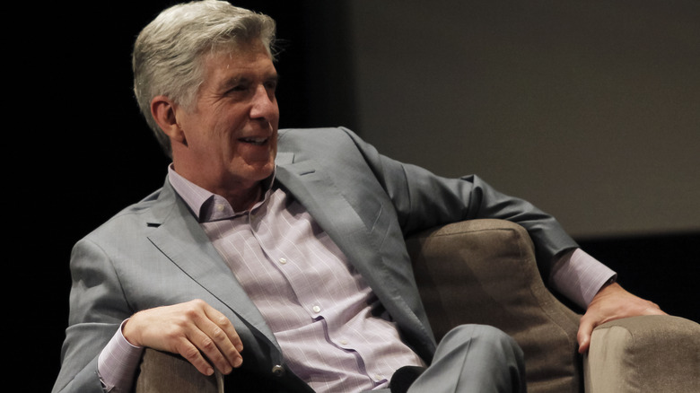 Tom Bergeron lounging in a chair