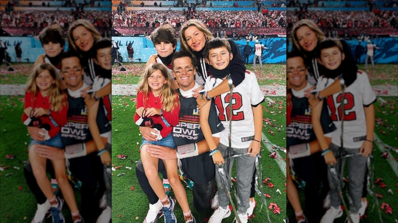 Tom Brady, Gisele Bündchen, and their three kids posing for a family photo after a Super Bowl win