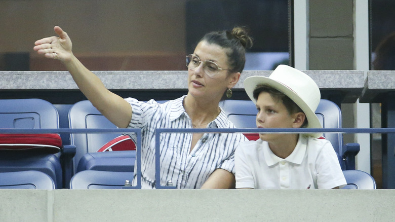 Jack Moynahan sitting with mom Bridget Moynahan in bleachers