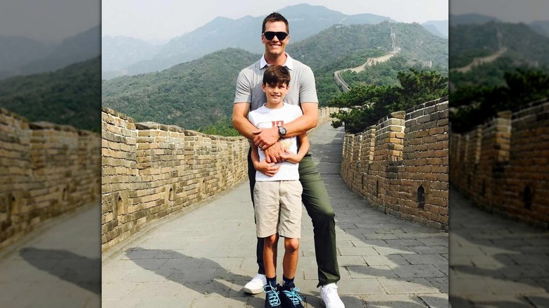 Tom Brady embracing Jack Moynahan on Great Wall of China