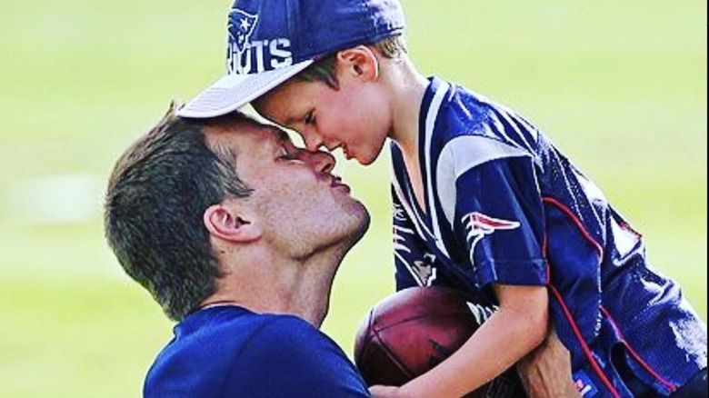 Tom Brady and his son Jack on field