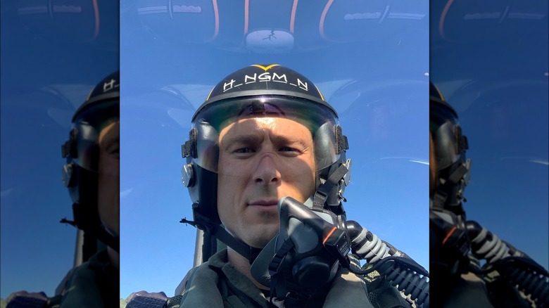 Actor Glen Powell takes a selfie while flying