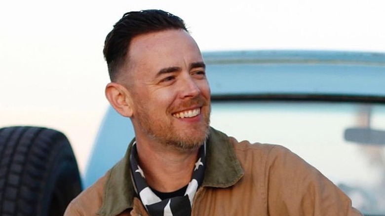 Colin Hanks sitting on truck