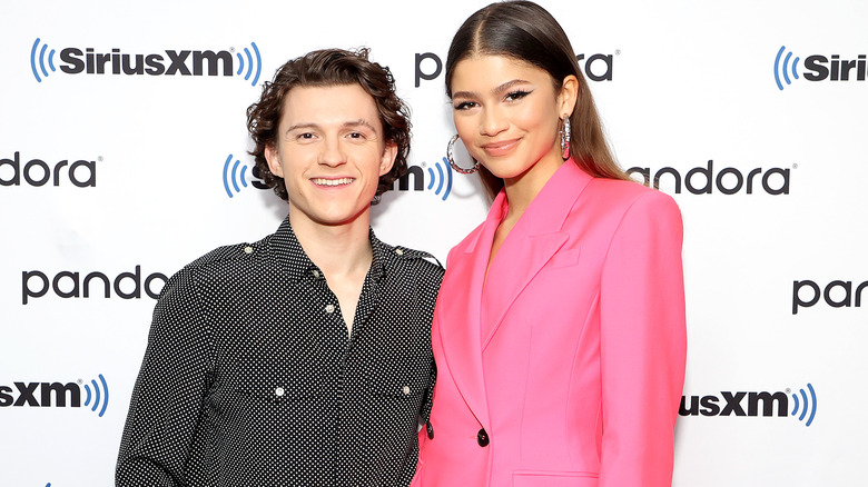 Tom Holland and Zendaya posing