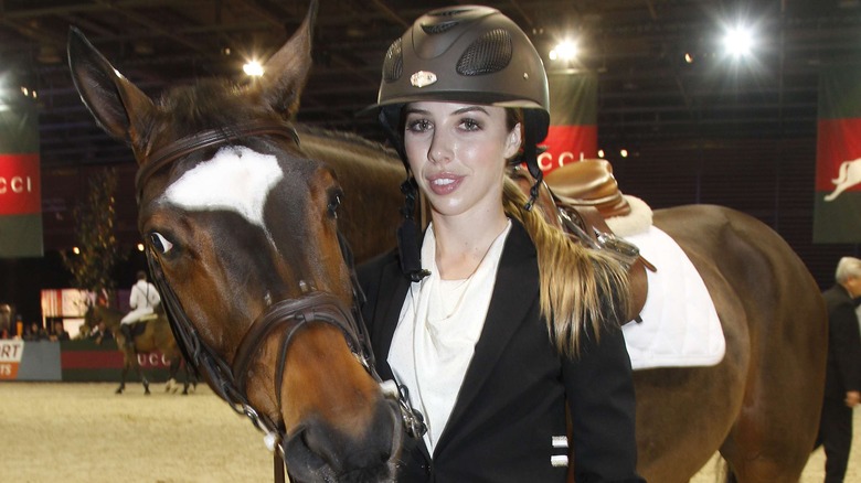 Hannah Selleck posing with horse